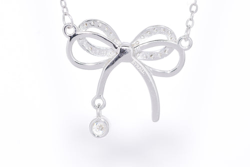 Close-up pavé moissanite bow with bezel drop rhodium silver S925 dainty necklace — Byrall Jewellery